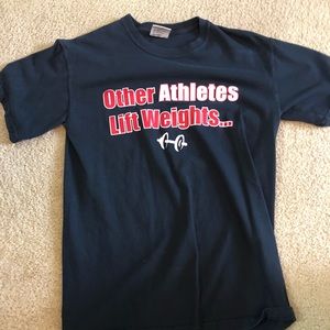 cheerleaders lift athletes shirt